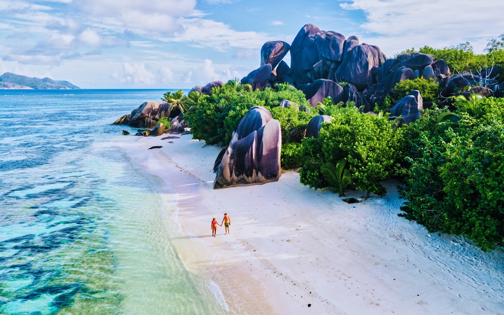 Aerial view of a pristine beach with granite rocks on a honeymoon Seychelles island